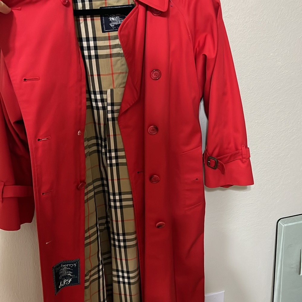 Vintage Burberry’s of London Red trench coat.